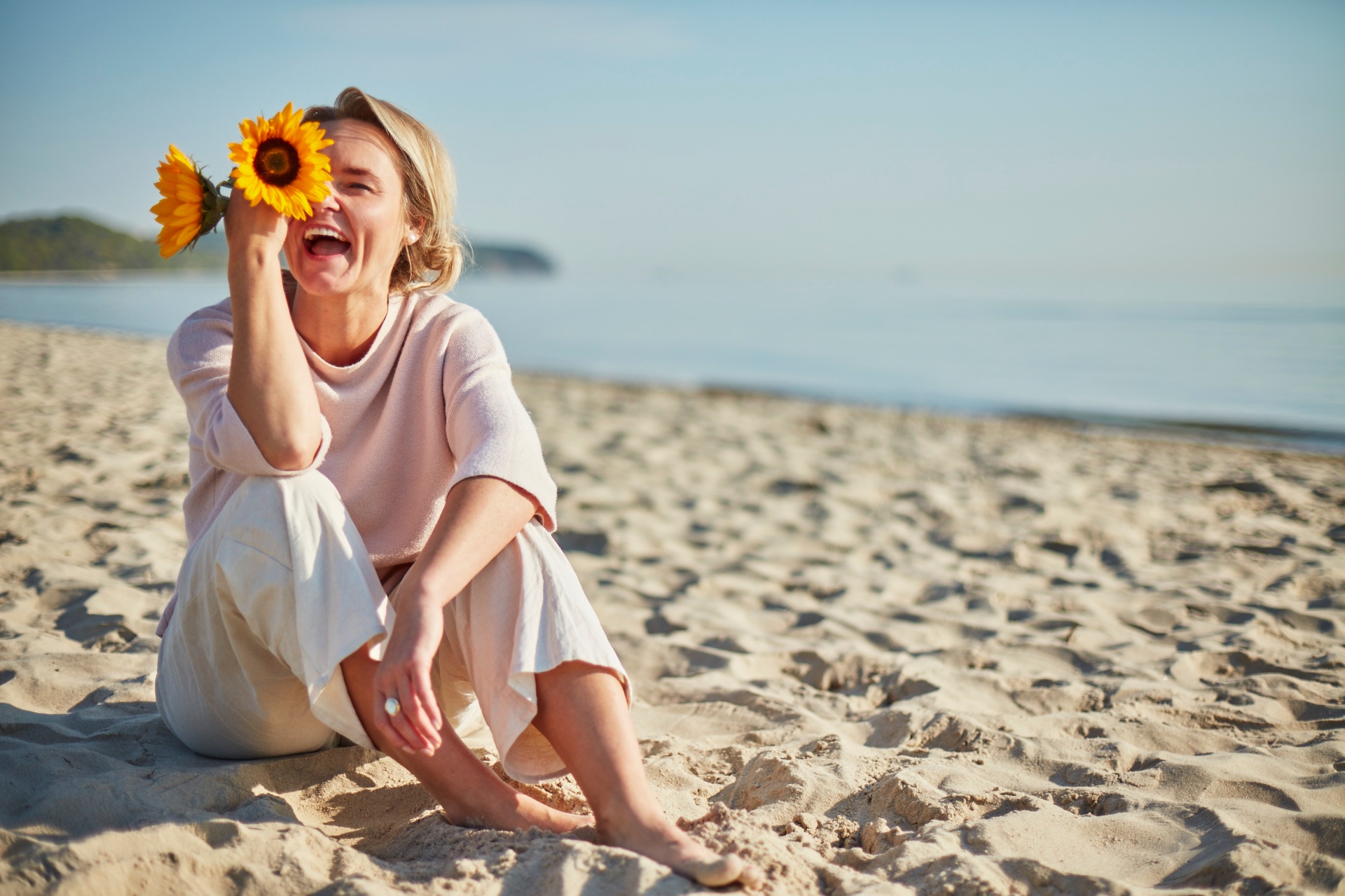 Joanna laughing with sunflowers
